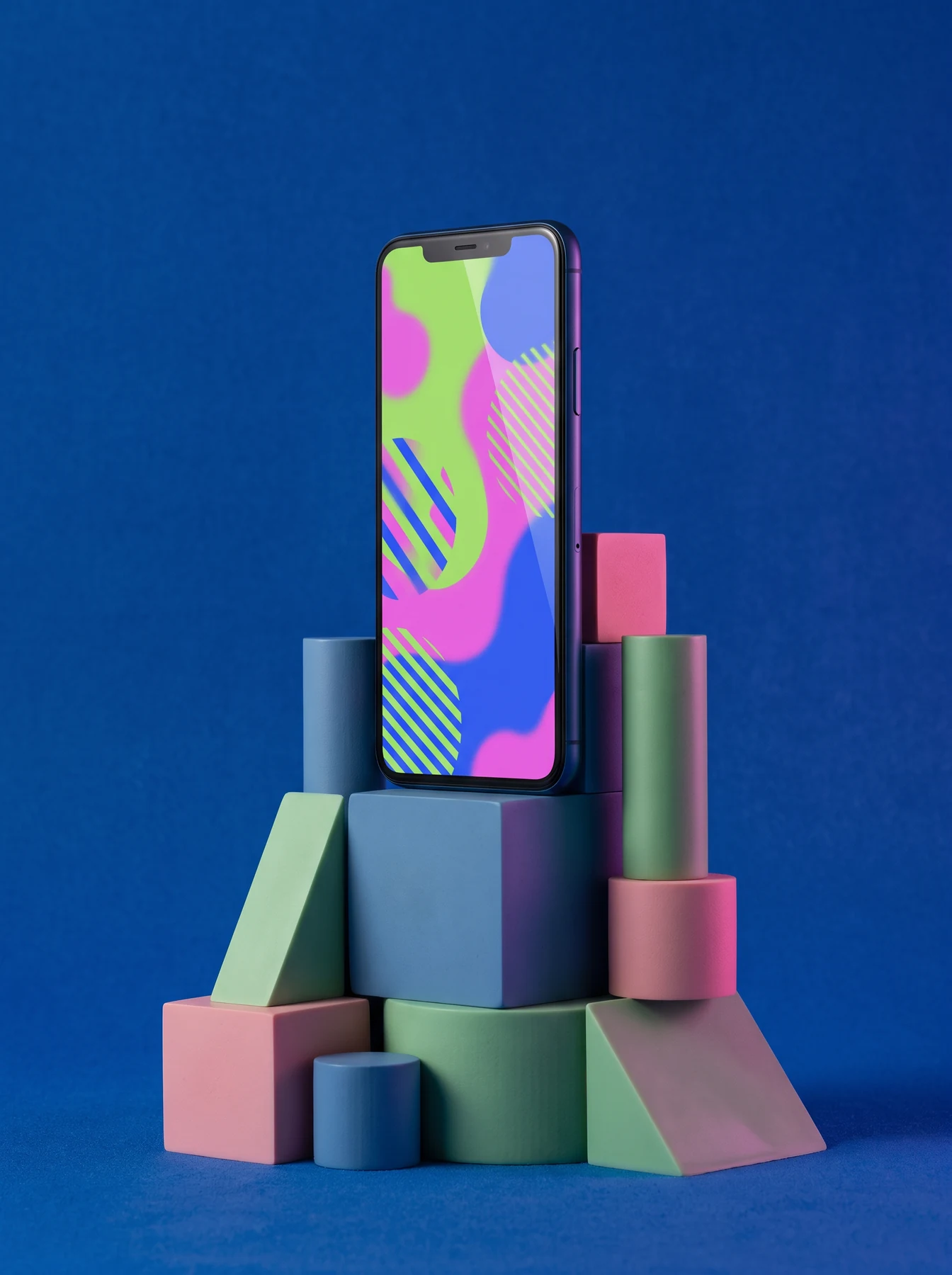 Smartphone mockup displayed on colourful geometric blocks